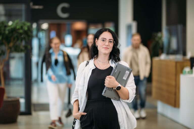 A student on Hämeenlinna campus lobby.