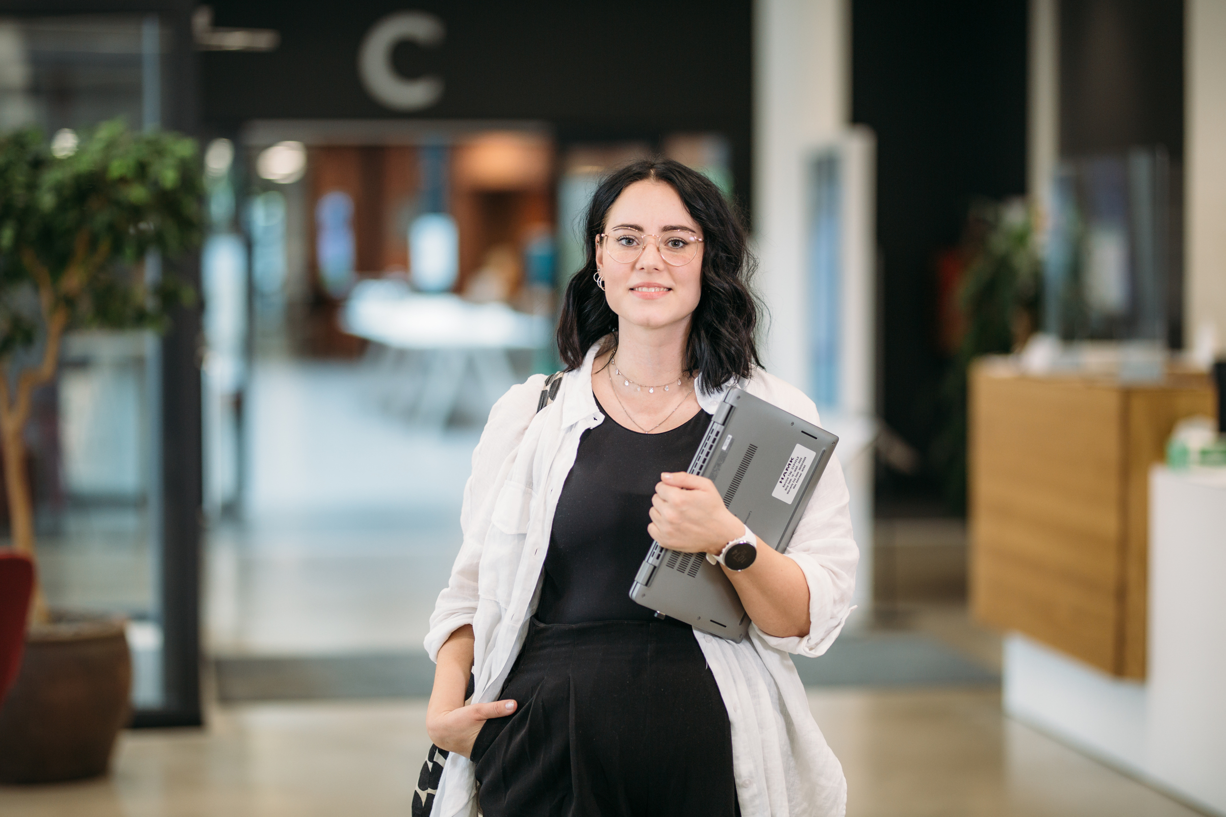 Woman standing on a hallway/ Nainen seisoon käytävällä